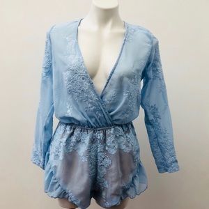 Blue Romper with deep V neckline